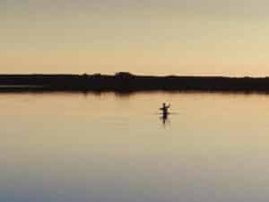 Angler fishing at sunrise