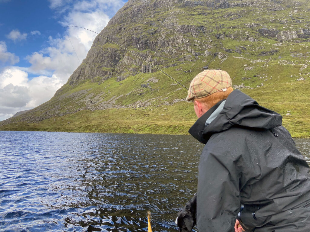 Fly fishing from a boat on a Scottish loch