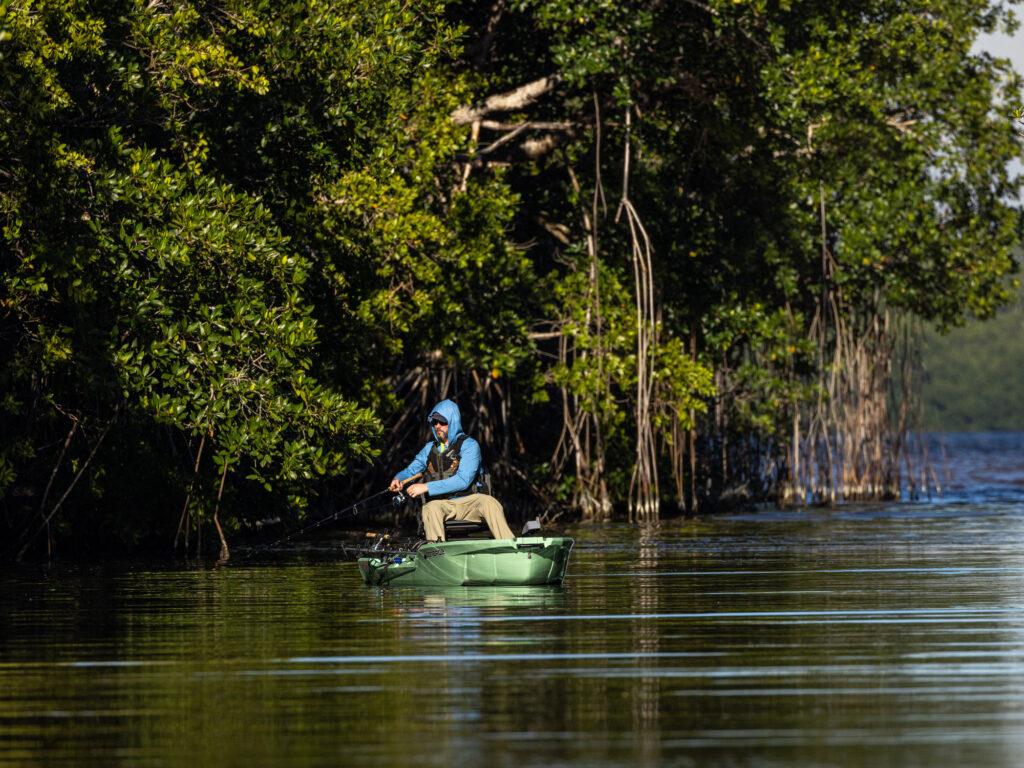 Angler fishes mangroves from a motorized kayak in the Everglades backcountry.