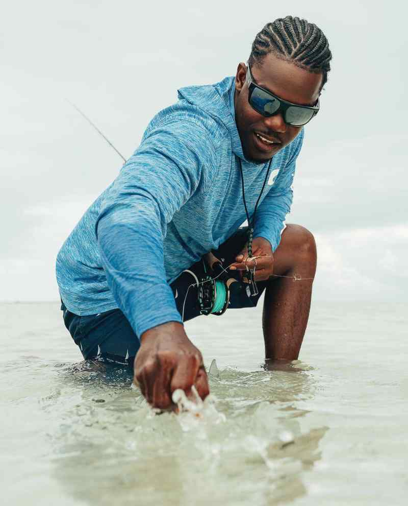 Fisherman releasing fish