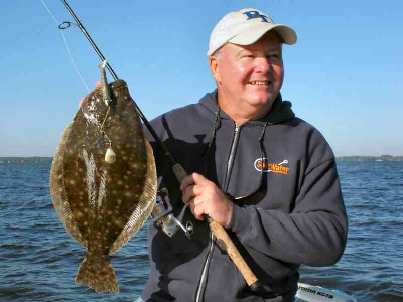 SPF0822-Trout-Flounder-Chris-Eric-Bob Angler holding a flounder