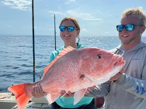 Atlantic_Snapper Two anglers hold a red snapper